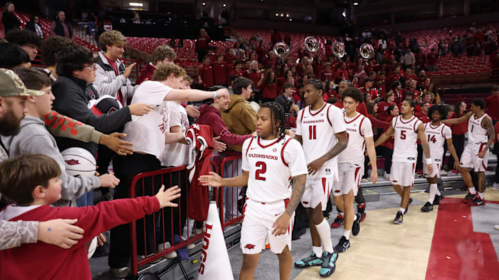 Dec 16, 2025; Fayetteville, Arkansas, USA; Arkansas Razorbacks players celebrate with the student section after the game against the Queens Royals at Bud Walton Arena. Arkansas won 108-80. Mandatory Credit: Nelson Chenault-Imagn Images Dec 16, 2025; Fayetteville, Arkansas, USA; Arkansas Razorbacks players celebrate with the student section after the game against the Queens Royals at Bud Walton Arena. Arkansas won 108-80. Mandatory Credit: Nelson Chenault-Imagn Images