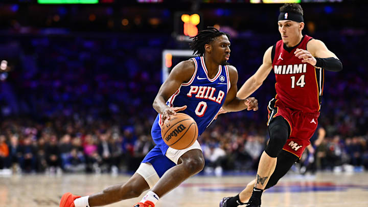 Feb 14, 2024; Philadelphia, Pennsylvania, USA; Philadelphia 76ers guard Tyrese Maxey (0) drives against Miami Heat guard Tyler Herro (14) in the fourth quarter at Wells Fargo Center. Mandatory Credit: Kyle Ross-Imagn Images