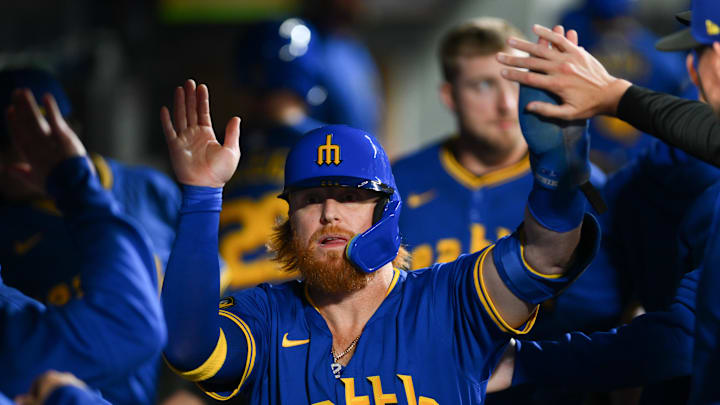Sep 14, 2024; Seattle, Washington, USA; Seattle Mariners first baseman Justin Turner (2) celebrates after scoring a run against the Texas Rangers during the second inning at T-Mobile Park.