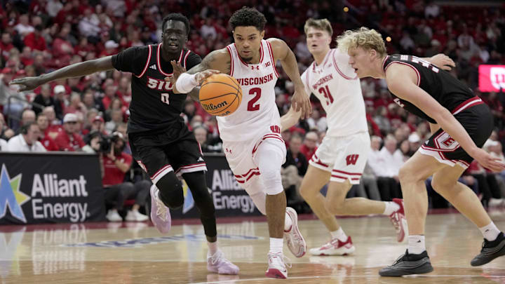 Wisconsin guard Nick Boyd (2) drives past Southern Illinois-Edwardsville forward Arnas Sakenis (34) during the second half of their game Monday, November 17, 2025 at the Kohl Center in Madison, Wisconsin. Wisconsin beat Southern Illinois-Edwardsville 94-69.