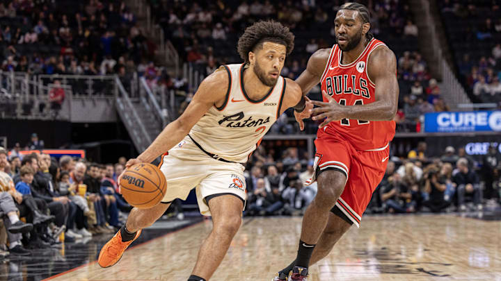 Nov 18, 2024; Detroit, Michigan, USA; Detroit Pistons guard Cade Cunningham (2) drives to the basket as Chicago Bulls forward Patrick Williams (44) defends during the first half at Little Caesars Arena. Mandatory Credit: David Reginek-Imagn Images