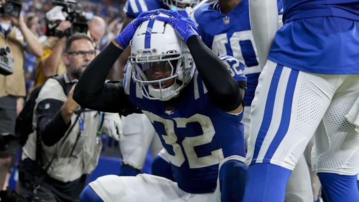 Sep 22, 2024; Indianapolis, Indiana, USA; Indianapolis Colts safety Julian Blackmon (32) celebrates an interception by Indianapolis Colts cornerback Jaylon Jones (40) on during a game against the Chicago Bears at Lucas Oil Stadium. Mandatory Credit: Grace Hollars USA TODAY Network via Imagn Images