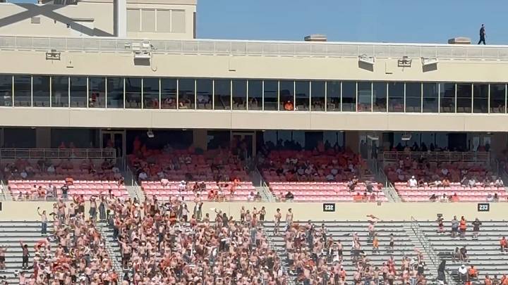 A swath of shirtless fans took over an empty section of stadium during Oklahoma State's loss on Saturday. A swath of shirtless fans took over an empty section of stadium during Oklahoma State's loss on Saturday.