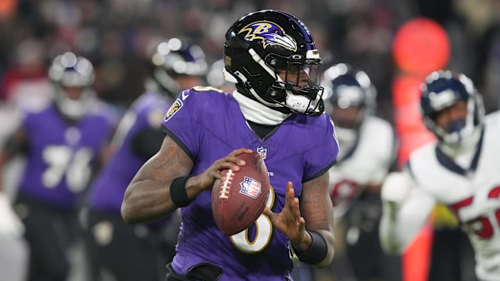 Jan 20, 2024; Baltimore, MD, USA; Baltimore Ravens quarterback Lamar Jackson (8) rolls out to throw against the Houston Texans during the second quarter of a 2024 AFC divisional round game at M&T Bank Stadium. Mandatory Credit: Mitch Stringer-Imagn Images