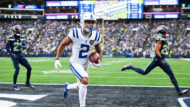 Dec 14, 2025; Seattle, Washington, USA; Indianapolis Colts wide receiver Josh Downs (2) runs into the end zone for a touchdown after catching a pass against the Seattle Seahawks during the second quarter at Lumen Field. Mandatory Credit: Steven Bisig-Imagn Images Dec 14, 2025; Seattle, Washington, USA; Indianapolis Colts wide receiver Josh Downs (2) runs into the end zone for a touchdown after catching a pass against the Seattle Seahawks during the second quarter at Lumen Field. Mandatory Credit: Steven Bisig-Imagn Images