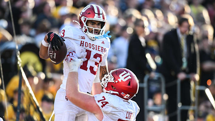 Indiana wide receiver Elijah Sarratt (13) celebrates with offensive lineman Bray Lynch.
