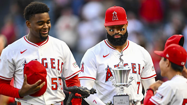 Sep 27, 2025; Anaheim, California, USA; Los Angeles Angels outfielder Jo Adell (7) holds the trophy for Team MVP award with pitcher José Soriano (59) who holds the trophy for Nick Adenhart’s Pitcher of the Year award before the game against the Houston Astros at Angel Stadium. Mandatory Credit: Jonathan Hui-Imagn Images Sep 27, 2025; Anaheim, California, USA; Los Angeles Angels outfielder Jo Adell (7) holds the trophy for Team MVP award with pitcher José Soriano (59) who holds the trophy for Nick Adenhart’s Pitcher of the Year award before the game against the Houston Astros at Angel Stadium. Mandatory Credit: Jonathan Hui-Imagn Images