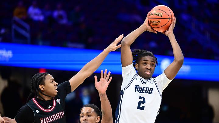 Mar 13, 2026; Cleveland, OH, USA; Toledo Rockets guard Leroy Blyden Jr. (2) looks to pass as Massachusetts Minutemen guard Danny Carbuccia (0) defends during the first half at Rocket Arena Mandatory Credit: Ken Blaze-Imagn Images Mar 13, 2026; Cleveland, OH, USA; Toledo Rockets guard Leroy Blyden Jr. (2) looks to pass as Massachusetts Minutemen guard Danny Carbuccia (0) defends during the first half at Rocket Arena Mandatory Credit: Ken Blaze-Imagn Images