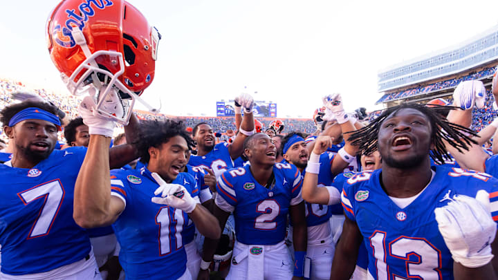 Florida Gators defensive back Trikweze Bridges (7), Florida Gators wide receiver Aidan Mizell (11), Florida Gators quarterback DJ Lagway (2) and Florida Gators running back Jadan Baugh (13) celebrateat Ben Hill Griffin Stadium in Gainesville, FL on Saturday, November 23, 2024. The Gators defeated the Rebels 24-17 [Doug Engle/Gainesville Sun]