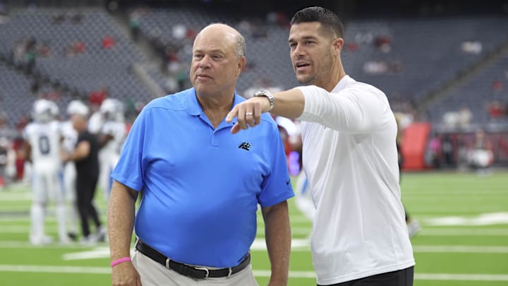 Aug 16, 2025; Houston, Texas, USA; Carolina Panthers head coach Dave Canales (right) talks with owner David Tepper before the game against the Houston Texans at NRG Stadium. Mandatory Credit: Troy Taormina-Imagn Images