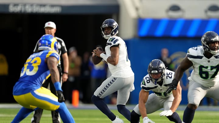 Nov 19, 2023; Inglewood, California, USA; Seattle Seahawks quarterback Geno Smith (7) looks to pass against the Los Angeles Rams in the first quarter at SoFi Stadium. Mandatory Credit: Kirby Lee-Imagn Images