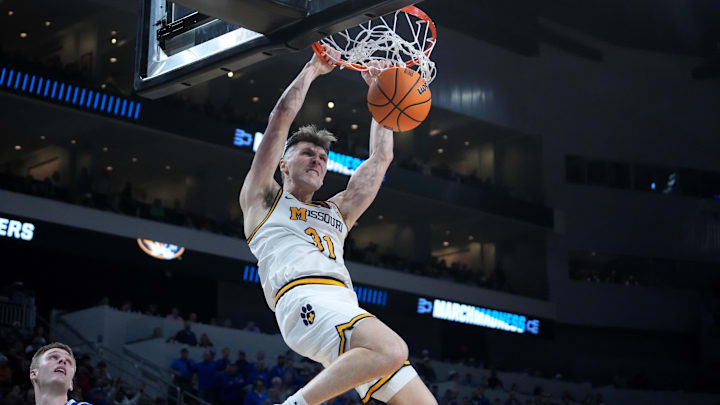 Mar 20, 2025; Wichita, KS, USA; Missouri Tigers guard Caleb Grill (31) dunks in the second half of a first round men’s NCAA Tournament game against the Drake Bulldogs at Intrust Bank Arena. Mandatory Credit: Kirby Lee-Imagn Images
