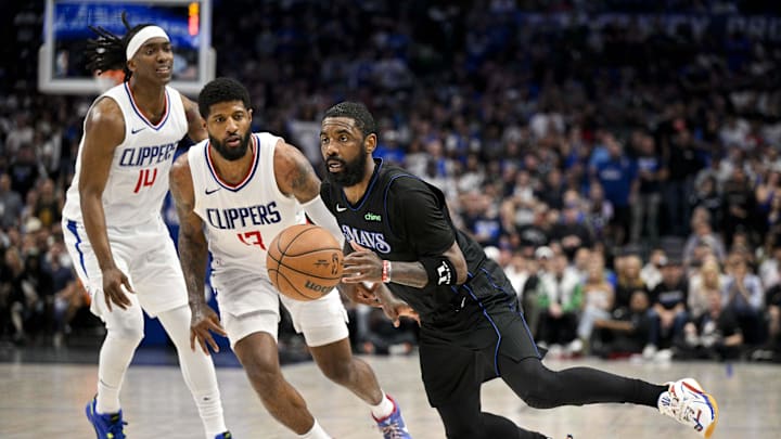 May 3, 2024; Dallas, Texas, USA; Dallas Mavericks guard Kyrie Irving (11) drives to the basket past