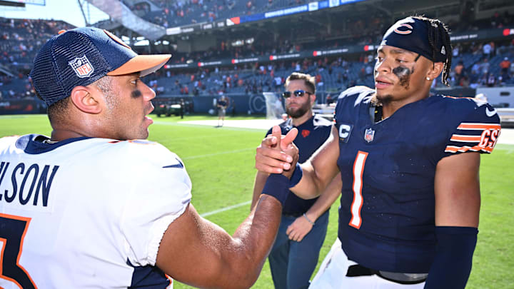 Oct 1, 2023; Chicago, Illinois, USA;  Chicago Bears quarterback Justin Fields (1), right, meets with