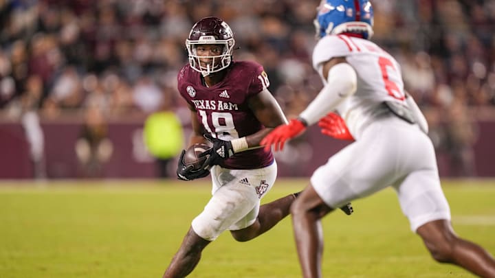 Oct 29, 2022; College Station, Texas, USA;  Texas A&M Aggies tight end Donovan Green (18) runs the ball against the Mississippi Rebels in the second half at Kyle Field. Mandatory Credit: Daniel Dunn-Imagn Images
