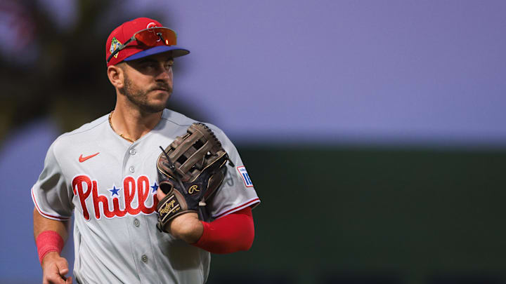 Feb 22, 2026; West Palm Beach, Florida, USA; Philadelphia Phillies first baseman Otto Kemp (4) returns to the dugout against the Washington Nationals during the first inning at CACTI Park of the Palm Beaches. Mandatory Credit: Sam Navarro-Imagn Images