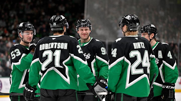 Jan 18, 2026; Dallas, Texas, USA; Dallas Stars center Wyatt Johnston (53) and left wing Jason Robertson (21) and right wing Mikko Rantanen (96) and center Roope Hintz (24) and defenseman Miro Heiskanen (4) huddle before a power play against the Tampa Bay Lightning during the second period at the American Airlines Center. Mandatory Credit: Jerome Miron-Imagn Images