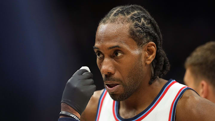 Apr 11, 2025; Sacramento, California, USA; Los Angeles Clippers forward Kawhi Leonard (2) receives medical treatment for a facial cut during the fourth quarter against the Sacramento Kings at Golden 1 Center.