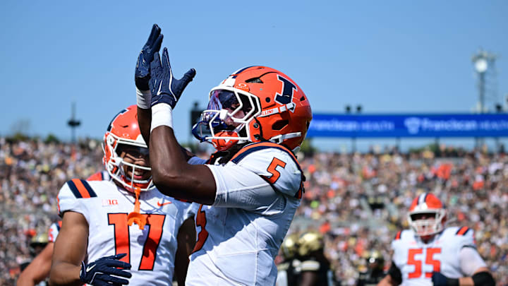 Oct 4, 2025; West Lafayette, Indiana, USA; Illinois Fighting Illini running back Ca'Lil Valentine (5) celebrates a touchdown during the second quarter against the Purdue Boilermakers at Ross-Ade Stadium. Mandatory Credit: Marc Lebryk-Imagn Images