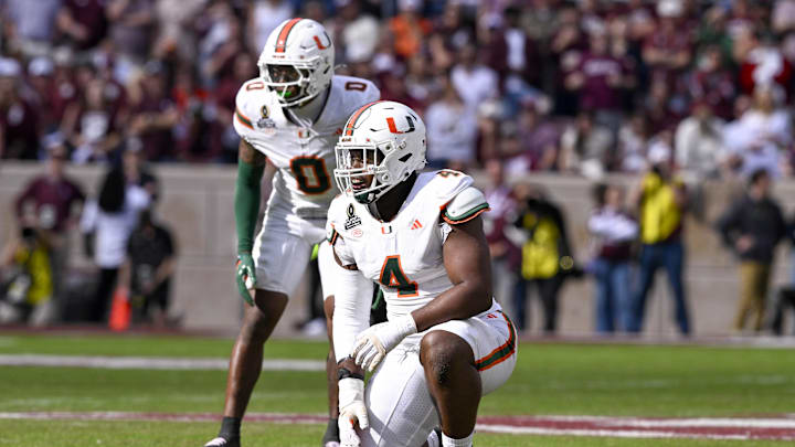 Dec 20, 2025; College Station, TX, USA; Miami Hurricanes defensive lineman Rueben Bain Jr. (4) kneels on the field during the game between the Aggies and the Hurricanes at Kyle Field. Mandatory Credit: Jerome Miron-Imagn Images