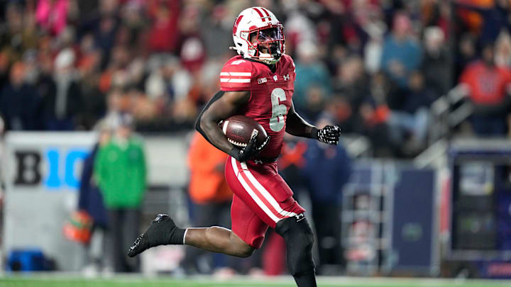 Nov 22, 2025; Madison, Wisconsin, USA; Wisconsin Badgers running back Darrion Dupree (6) runs the ball for an 84-yard touchdown against the Illinois Fighting Illini during the second half at Camp Randall Stadium. Mandatory Credit: Kayla Wolf-Imagn Images Nov 22, 2025; Madison, Wisconsin, USA; Wisconsin Badgers running back Darrion Dupree (6) runs the ball for an 84-yard touchdown against the Illinois Fighting Illini during the second half at Camp Randall Stadium. Mandatory Credit: Kayla Wolf-Imagn Images