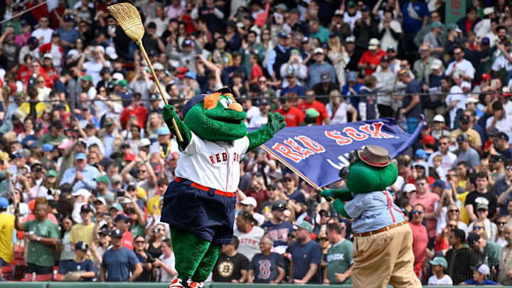 Jun 15, 2025; Boston, Massachusetts, USA; Boston Red Sox mascot Wally and his father Walter celebrate defeating the New York Yankees and sweeping the series at Fenway Park. Mandatory Credit: Eric Canha-Imagn Images