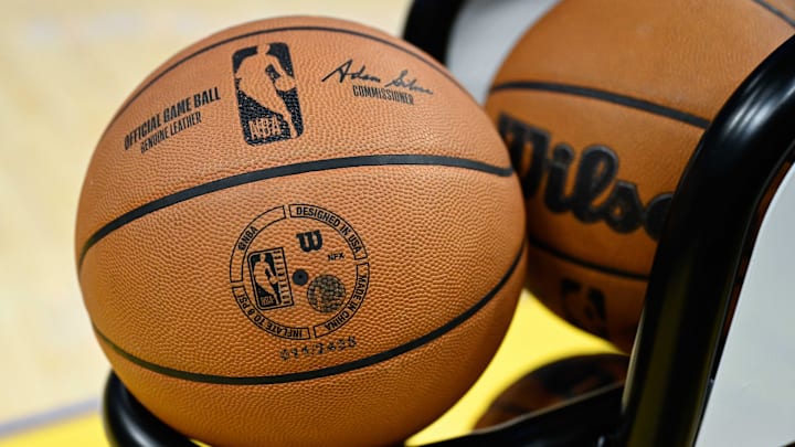 The NBA logo on a basketball during warm ups before a game. 