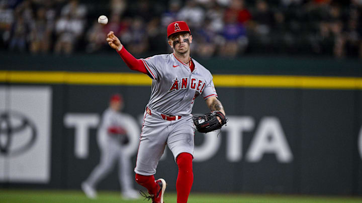 Sep 5, 2024; Arlington, Texas, USA; Los Angeles Angels shortstop Zach Neto (9) overthrows first base while trying to put out Texas Rangers center fielder Leody Taveras (not pictured) during the second inning at Globe Life Field. Mandatory Credit: Jerome Miron-Imagn Images