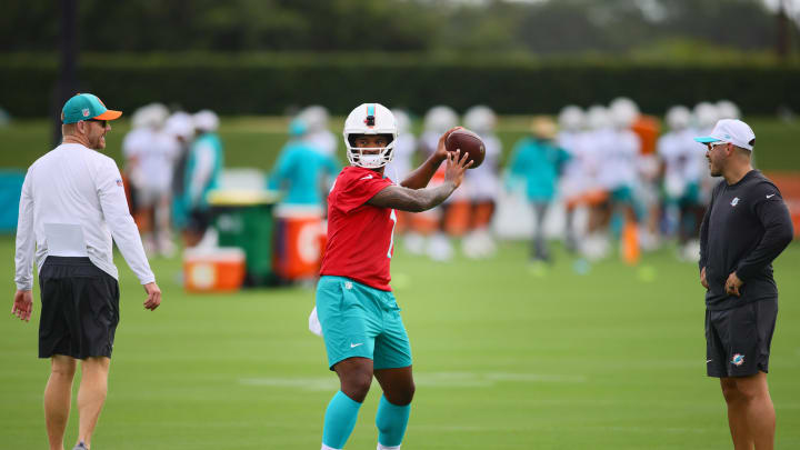 Jul 24, 2024; Miami Gardens, FL, USA; Miami Dolphins quarterback Tua Tagovailoa (1) throws the football during training camp at Baptist Health Training Complex. Jul 24, 2024; Miami Gardens, FL, USA; Miami Dolphins quarterback Tua Tagovailoa (1) throws the football during training camp at Baptist Health Training Complex.