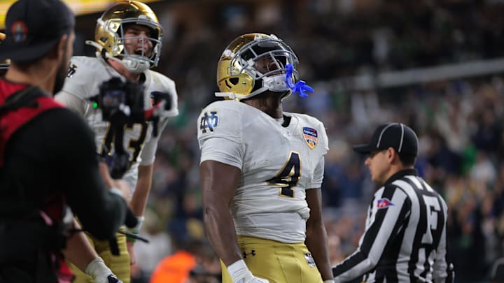 Jan 9, 2025; Miami, FL, USA; Notre Dame Fighting Irish running back Jeremiyah Love (4) celebrates a touch down in the second half against the Penn State Nittany Lions in the Orange Bowl at Hard Rock Stadium. Jan 9, 2025; Miami, FL, USA; Notre Dame Fighting Irish running back Jeremiyah Love (4) celebrates a touch down in the second half against the Penn State Nittany Lions in the Orange Bowl at Hard Rock Stadium.