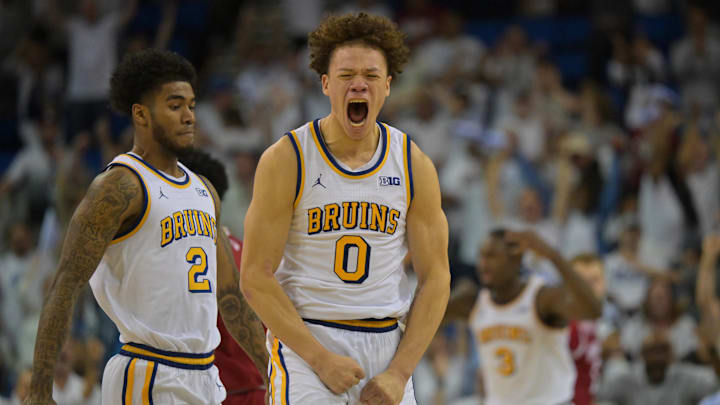 Jan 31, 2026; Los Angeles, California, USA;  UCLA Bruins guard Trent Perry (0) reacts after a three-point basket to tie the game with one second in regulation time against the Indiana Hoosiers at Pauley Pavilion presented by Wescom Financial. Mandatory Credit: Jayne Kamin-Oncea-Imagn Images