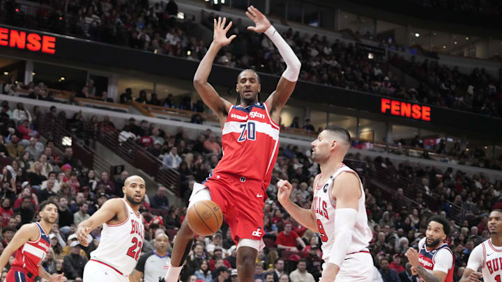 Apr 11, 2025; Chicago, Illinois, USA; Chicago Bulls center Nikola Vucevic (9) defends Washington Wizards forward Alex Sarr (20) during the second half at United Center. Mandatory Credit: David Banks-Imagn Images