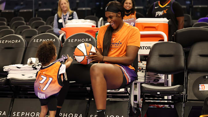 Jul 14, 2025; San Francisco, California, USA; Phoenix Mercury center Kalani Brown (21) engages with a young fan before the game against the Golden State Valkyries at Chase Center. Mandatory Credit: Kelley L Cox-Imagn Images