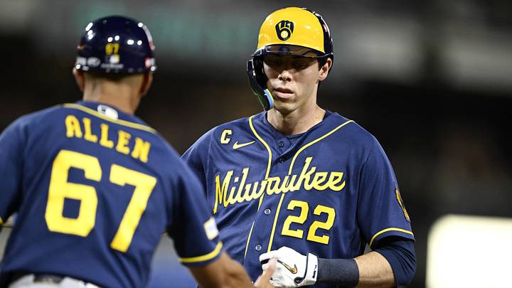 Oct 6, 2026; San Diego, California, USA;  Milwaukee Brewers designated hitter Christian Yelich (22) reacts after hitting a single during the second inning against the San Diego Padres in game three of the NLDS for the 2026 MLB Playoffs at Petco Park.  Mandatory Credit: Denis Poroy-Imagn Images