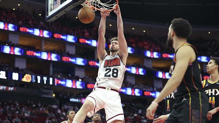 Mar 12, 2025; Houston, Texas, USA; Houston Rockets center Alperen Sengun (28) dunks the ball during the fourth quarter against the Phoenix Suns at Toyota Center. Mandatory Credit: Troy Taormina-Imagn Images