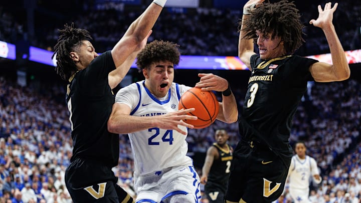 Feb 28, 2026; Lexington, Kentucky, USA; Kentucky Wildcats center Malachi Moreno (24) drives to the basket against Vanderbilt Commodores guard Chandler Bing (7) and guard Tyler Tanner (3) during the second half at Rupp Arena at Central Bank Center. Mandatory Credit: Jordan Prather-Imagn Images