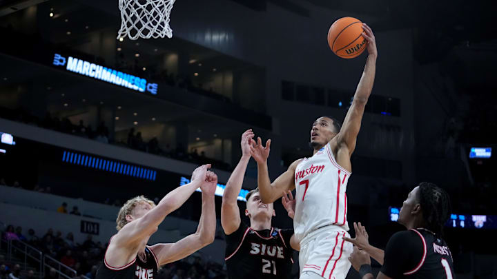 Mar 20, 2025; Wichita, KS, USA; Houston Cougars guard Milos Uzan (7) shoots against SIU Edwardsville Cougars center Arnas Sakenis (34), forward Myles Thompson (21) and guard Jordan Pickett (1) in the first half of a first round men’s NCAA Tournament game at Intrust Bank Arena. Mandatory Credit: Kirby Lee-Imagn Images Mar 20, 2025; Wichita, KS, USA; Houston Cougars guard Milos Uzan (7) shoots against SIU Edwardsville Cougars center Arnas Sakenis (34), forward Myles Thompson (21) and guard Jordan Pickett (1) in the first half of a first round men’s NCAA Tournament game at Intrust Bank Arena. Mandatory Credit: Kirby Lee-Imagn Images