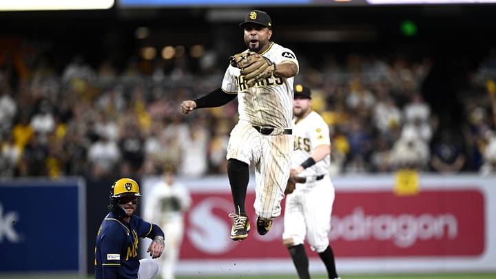 Oct 6, 2026; San Diego, California, USA; San Diego Padres shortstop Xander Bogaerts (2) turns a game ending double play during the ninth inning against the Milwaukee Brewers in game three of the NLDS for the 2026 MLB Playoffs at Petco Park. Mandatory Credit: Denis Poroy-Imagn Images Oct 6, 2026; San Diego, California, USA; San Diego Padres shortstop Xander Bogaerts (2) turns a game ending double play during the ninth inning against the Milwaukee Brewers in game three of the NLDS for the 2026 MLB Playoffs at Petco Park. Mandatory Credit: Denis Poroy-Imagn Images