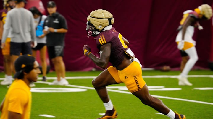 Arizona State running back Kanye Udoh (6) runs in a drill during a practice inside the Verde Dickey Dome in Tempe on Aug. 12, 2025.
