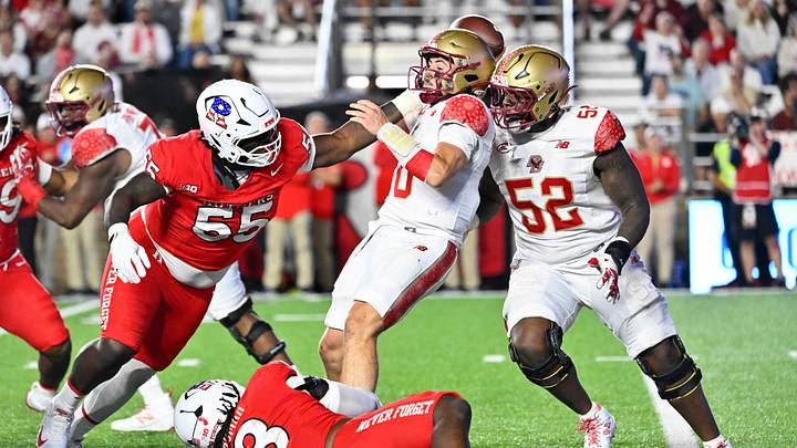 Sep 11, 2026; Chestnut Hill, Massachusetts, USA; Boston College Eagles quarterback Mason McKenzie (10) throws an interception as he is tackled by Rutgers Scarlet Knights defensive lineman Zaire Angoy (55) and defensive lineman Sekou Kromah (8) during the second half at Alumni Stadium. Mandatory Credit: Eric Canha-Imagn Images Sep 11, 2026; Chestnut Hill, Massachusetts, USA; Boston College Eagles quarterback Mason McKenzie (10) throws an interception as he is tackled by Rutgers Scarlet Knights defensive lineman Zaire Angoy (55) and defensive lineman Sekou Kromah (8) during the second half at Alumni Stadium. Mandatory Credit: Eric Canha-Imagn Images