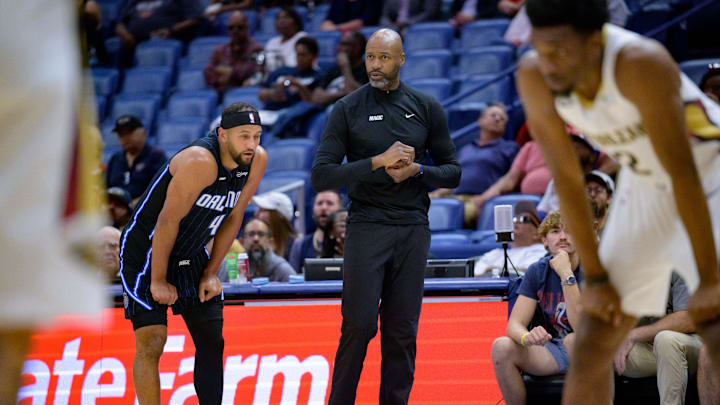 Oct 7, 2024; New Orleans, Louisiana, USA; Orlando Magic head coach Jamahl Mosley talks to Orlando Magic guard Jalen Suggs (4) during the first half at Smoothie King Center. Mandatory Credit: Matthew Hinton-Imagn Images