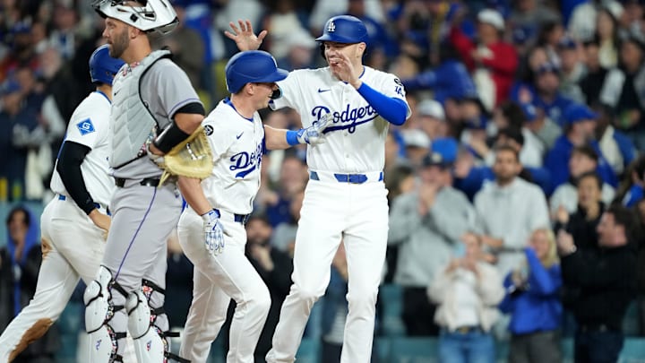 Apr 15, 2025; Los Angeles, California, USA; Los Angeles Dodgers catcher Will Smith (16) celebrates with first baseman Freddie Freeman (5) after hitting a three run home run in the third inning against the Colorado Rockies at Dodger Stadium. All players wore #42 for Jackie Robinson Day.