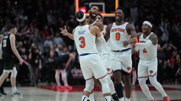 Mar 12, 2025; Portland, Oregon, USA; New York Knicks small forward Mikal Bridges (25) celebrates with teammates after making the game-winning shot in overtime against the Portland Trail Blazers at Moda Center. Mandatory Credit: Soobum Im-Imagn Images