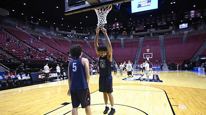 Mar 19, 2026; San Diego, CA, USA; Arizona Wildcats guard Brayden Burries (5) and forward Koa Peat (10) talk during a practice session ahead of the first round of the men's 2026 NCAA Tournament at Viejas Arena. Mandatory Credit: Denis Poroy-Imagn Images