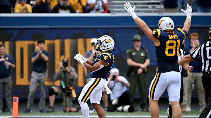 Jahiem White celebrates in the endzone during the win against Kansas last month.