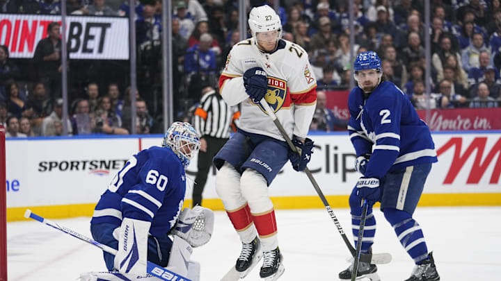May 18, 2025; Toronto, Ontario, CAN; Toronto Maple Leafs goaltender Joseph Woll (60) and defenceman Simon Benoit (2) look for the puck as Florida Panthers forward Eetu Luostarinen (27) jumps out of the way during the second period of game seven of the second round of the 2025 Stanley Cup Playoffs at Scotiabank Arena. Mandatory Credit: John E. Sokolowski-Imagn Images May 18, 2025; Toronto, Ontario, CAN; Toronto Maple Leafs goaltender Joseph Woll (60) and defenceman Simon Benoit (2) look for the puck as Florida Panthers forward Eetu Luostarinen (27) jumps out of the way during the second period of game seven of the second round of the 2025 Stanley Cup Playoffs at Scotiabank Arena. Mandatory Credit: John E. Sokolowski-Imagn Images