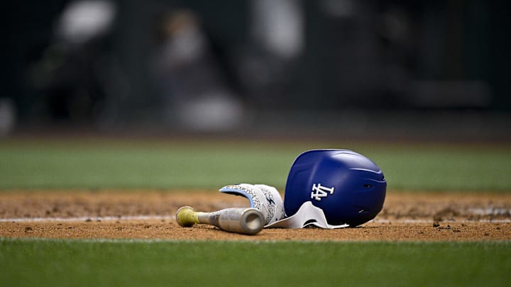 A view of a Los Angeles Dodgers batting helmet and bat during the game between the Texas Rangers and the Los Angeles Dodgers at Globe Life Field on April 20.