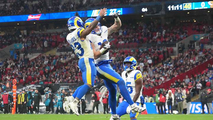 Oct 19, 2025; London, United Kingdom; Los Angeles Rams tight end Terrance Ferguson (18) celebrates with running back Kyren Williams (23) as wide receiver Konata Mumpfield (15) watches after scoring on a 31-yard touchdown reception in the fourth quarter against the Jacksonville Jaguars during a NFL International Series game at Wembley Stadium. Mandatory Credit: Kirby Lee-Imagn Images Oct 19, 2025; London, United Kingdom; Los Angeles Rams tight end Terrance Ferguson (18) celebrates with running back Kyren Williams (23) as wide receiver Konata Mumpfield (15) watches after scoring on a 31-yard touchdown reception in the fourth quarter against the Jacksonville Jaguars during a NFL International Series game at Wembley Stadium. Mandatory Credit: Kirby Lee-Imagn Images