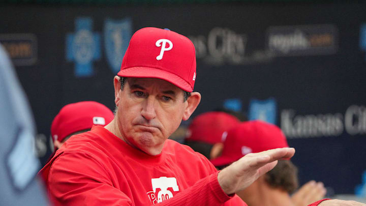 Aug 23, 2024; Kansas City, Missouri, USA; Philadelphia Phillies manager Rob Thomson (59) in the dugout against the Kansas City Royals prior to a game at Kauffman Stadium. Mandatory Credit: Denny Medley-Imagn Images