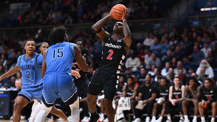 Dec 3, 2024; Villanova, Pennsylvania, USA; Cincinnati Bearcats guard Jizzle James (2) drives to shoot against Villanova Wildcats guard Jordan Longino (15) in the second half at William B. Finneran Pavilion. Mandatory Credit: Kyle Ross-Imagn Images Dec 3, 2024; Villanova, Pennsylvania, USA; Cincinnati Bearcats guard Jizzle James (2) drives to shoot against Villanova Wildcats guard Jordan Longino (15) in the second half at William B. Finneran Pavilion. Mandatory Credit: Kyle Ross-Imagn Images